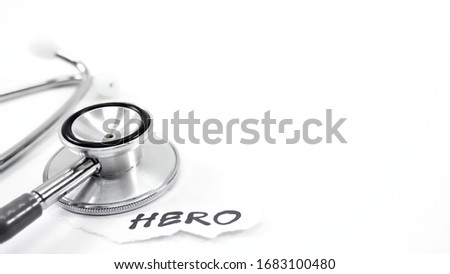Black doctor stethoscope On a white background There is a text HERO beside the picture in the left corner. There is a copy space on the right side.