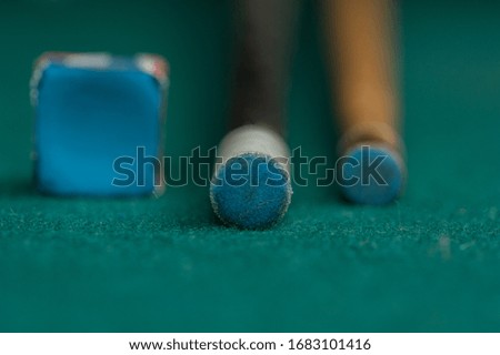 Billiards balls and cue on billiards table. Billiard sport concept.