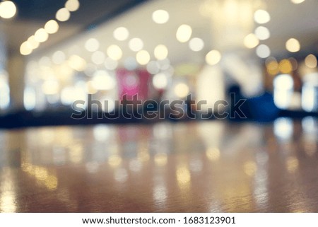wooden table empty of display in cafe with luxury light decoration for dinner celebration