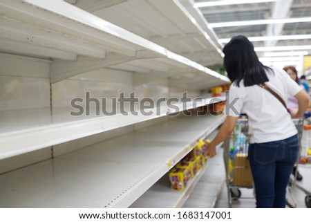 Blurred image of customer buying foods in grocery store. Covid-19 panic buying hits Penang, Malaysia.