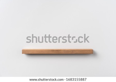 Design concept - front view empty bookshelf and grey wall for mockup, not 3D render Royalty-Free Stock Photo #1683155887