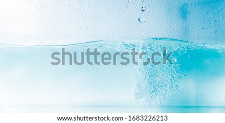 A splatter of blue water isolated on a white background
