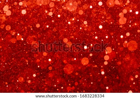 Red bokeh of light textured glitter background