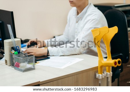 Man in white shirt working in the office