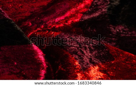 Texture, background, pattern, design, red yellow brown velvet fabric, dense fabric of silk, cotton or nylon with a thick short pile on one side.