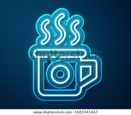 Glowing neon line Cup of tea icon isolated on blue background. Sweet natural food.  Vector Illustration