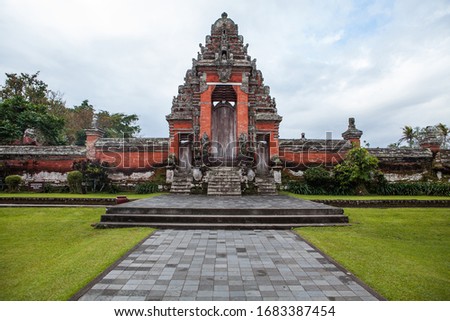 Beautiful architecture of Ancient Hindu Bali temple surrounded by tropical garden. This Taman Ayun Temple is one of the most beautiful of Balinese Art. Indonesia.