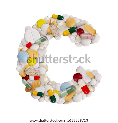 Capital letter C made of various colorful pills, capsules and tablets on isolated white background