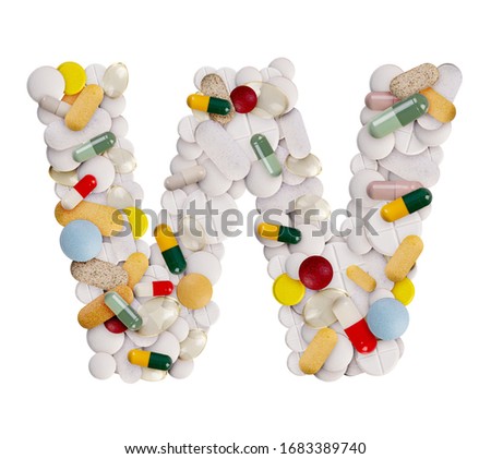 Capital letter W made of various colorful pills, capsules and tablets on isolated white background