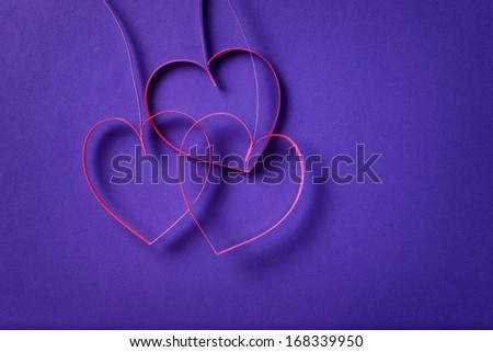 paper flowers with hearts on purple background, valentine day