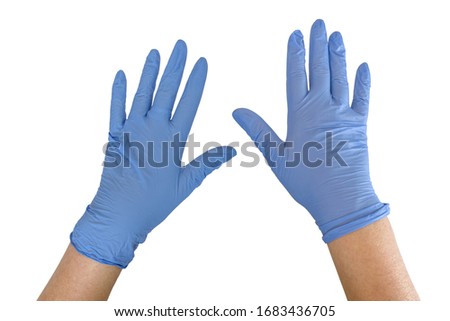 Hands of woman with two blue medical gloves isolated on white background