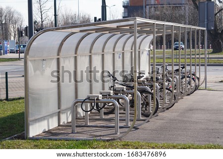 Parking for Bicycle near an apartment building with a large number of bicycles. Eco-friendly and sports transport in the city. Royalty-Free Stock Photo #1683476896
