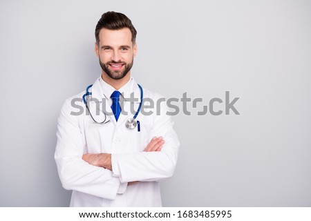 Close-up portrait of his he nice attractive content experienced cheerful cheery bearded guy ceo boss chief director med expert visit folded arms isolated over light white gray pastel color background Royalty-Free Stock Photo #1683485995