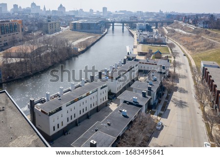 Aerial view of North Commerce Street in Milwaukee WI featuring the Milwaukee River and downtown skyline