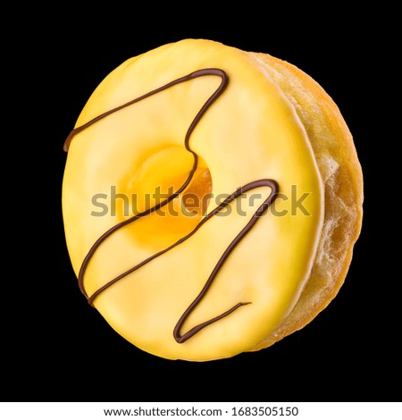 Glazed donut with sprinkles on a black background. Isolated with clipping path