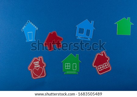 Miniature house on blue background. Top view.   Buy of property, home, real estate. affordable housing. advantageous offer from the bank. 