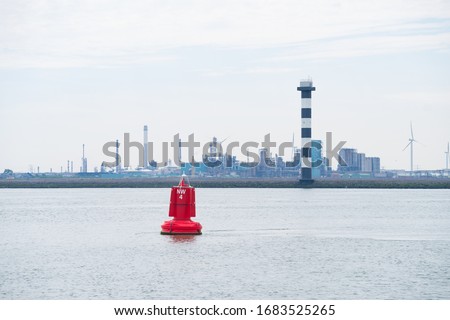 red navigation buoy in the New Water Way (Nieuwe Waterweg), the access to the Rotterdam Port