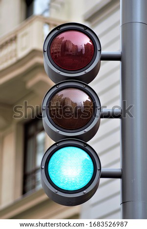 Red or yellow or green traffic light in the city isolated with the blurred background
