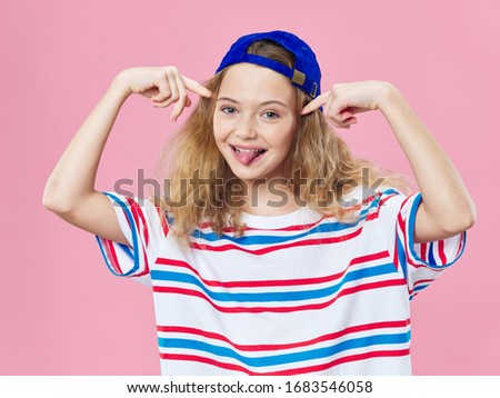 Cheerful fashionable girl curly hair lifestyle clothes pink background