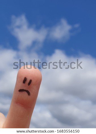 Sad-faced finger drawn, sky in the background. Related to sadness, crying, loss and other sad moods.
Useful as backgrounds in medical concepts, psychology, business, cartoons.