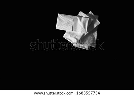Paper handkerchiefs of a black background