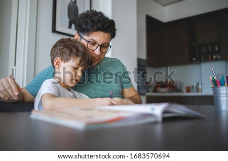 Young Father homeschooling his son