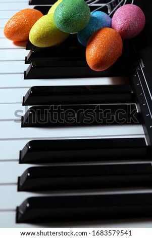 Colorful Paschal Easter Eggs and Piano Keys
