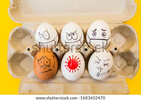 drawing faces on eggs isolated on yellow background