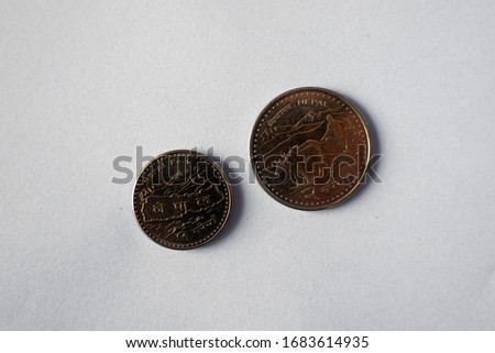 Two Nepal Rupee Coins on a white background.