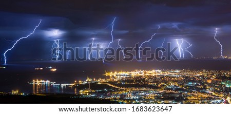Lightning barrage at cold front passing in Trieste gulf.