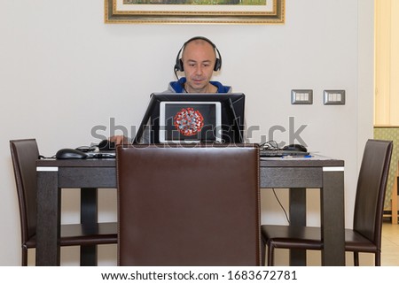 Man Works from Home Because of the Cornavirus: smartworking. Royalty-Free Stock Photo #1683672781