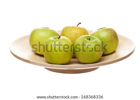 green apples on wooden plate
