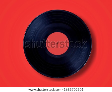 Classic vinyl record on a colored background.
