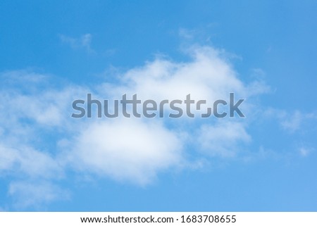 blue sky with flying white light clouds
