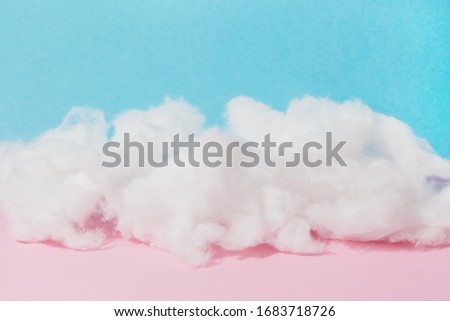 soft cotton wool cloud on pink and blue background, copy space, horizontal banner Royalty-Free Stock Photo #1683718726