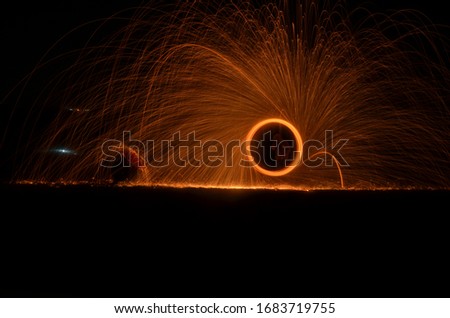 Steel wool art and a man who tries to be hidden from its fire.