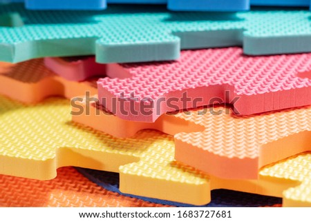 Macro photo of the details of a foam eva. Colored rubber mat puzzle for children.