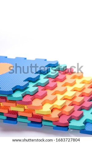 Macro photo of the details of a foam eva. Colored rubber mat puzzle for children.