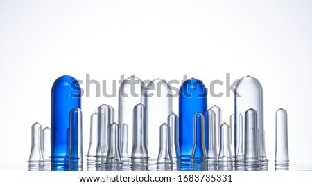 Plastic preform line up blowing molds transparent on white background Royalty-Free Stock Photo #1683735331