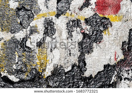 Fragment of colored graffiti painted on a wall. Bright abstract backdrop for design with peeling paint.