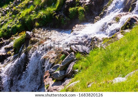 cascade of balea stream. nature scenery of fagaras mountains on a sunny summer day