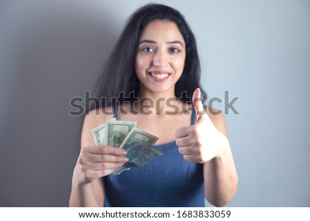 happy woman hand okay sign with money