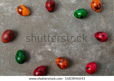 Colorful quail eggs on a concrete table. Easter Eggs concept. Easter Eggs concept. Background with space to text. Easter mocku up