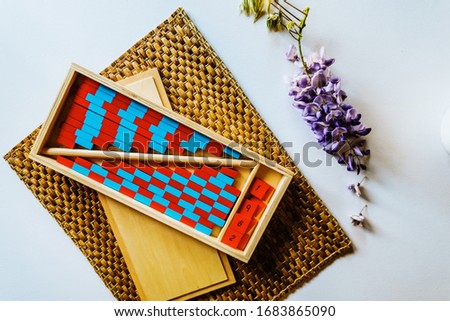 Red and blue montessori wood stripe to learn arithmetic in class.