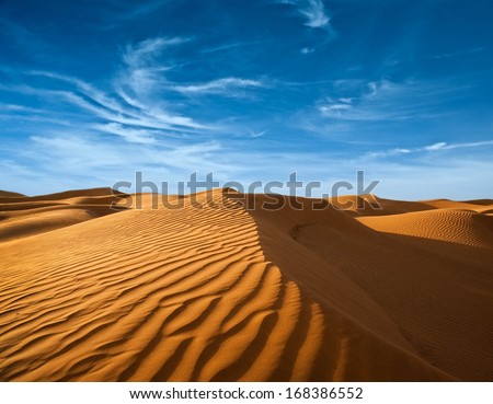 Desert of North Africa, sandy barkhans Royalty-Free Stock Photo #168386552