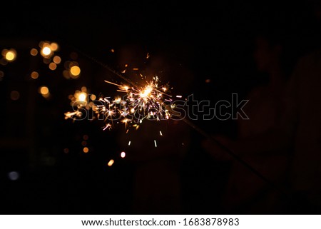 Burning sparkler on dark background.s pace for text. happy new year and merry christmas concept. happy holidays