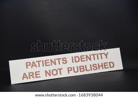 sheet of paper with text Patients identity are not published with a black background.