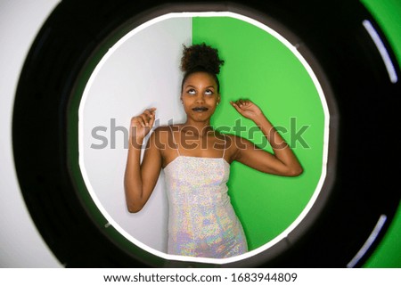 black girl influencer in front of spotlight