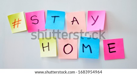 Call to stay home during a coronavirus epidemic to protect against the virus. Covid-19 outbreak concept. Hashtag stayhome. Pink background endless moving note stickers. Royalty-Free Stock Photo #1683954964