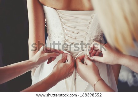 beautiful bride is getting ready in the morning Royalty-Free Stock Photo #168398552